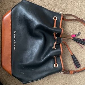 We are selling a vintage dooney and bourke used bag no damage rainbow interior